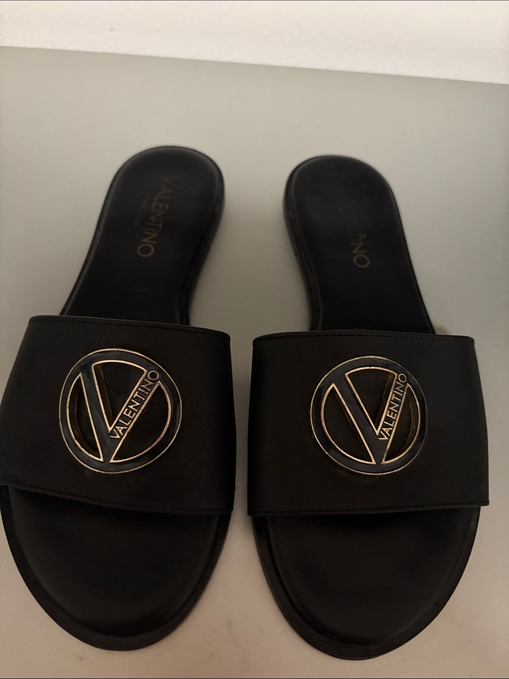 Valentino Black Slide Sandals with Gold Logo Medallion